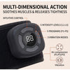 A black multi-dimensional action massager device is shown resting on a black fabric, highlighting its controls and features.