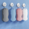 A set of exfoliating bath sponges in various pastel colors, including gray, blue, pink, and white.