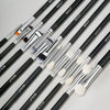 A collection of 30 professional makeup brushes with black handles and silver ferrules displayed diagonally.