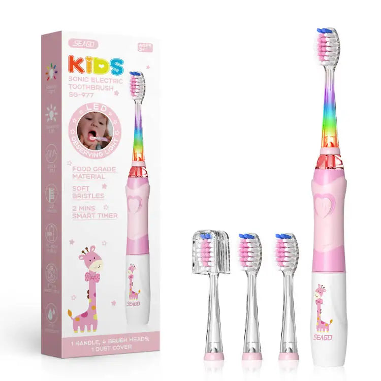 A pink kids electric toothbrush with a smart timer and LED light is shown standing upright.