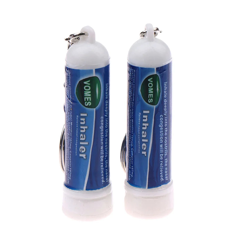 A pair of white nasal relief sticks with blue labels and metal caps.