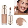 A cosmetic product featuring a liquid bronzer contour foundation stick in a glass tube and a round applicator, shown next to 