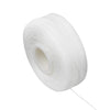A white spool of dental floss for oral hygiene.