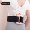 A woman is shown wearing a black fascia massager belt around her waist while wearing a white top.