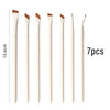 A set of seven precision angled eyeliner and eyebrow makeup brushes in beige and brown shades.