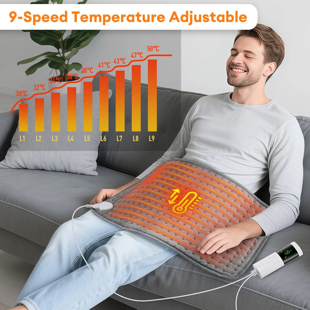 A man is using a 9-speed temperature adjustable electric heating pad on his lap while relaxing on a sofa.