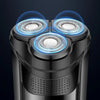 Close-up view of an intelligent rechargeable electric shaver with three shaving heads and a black body.