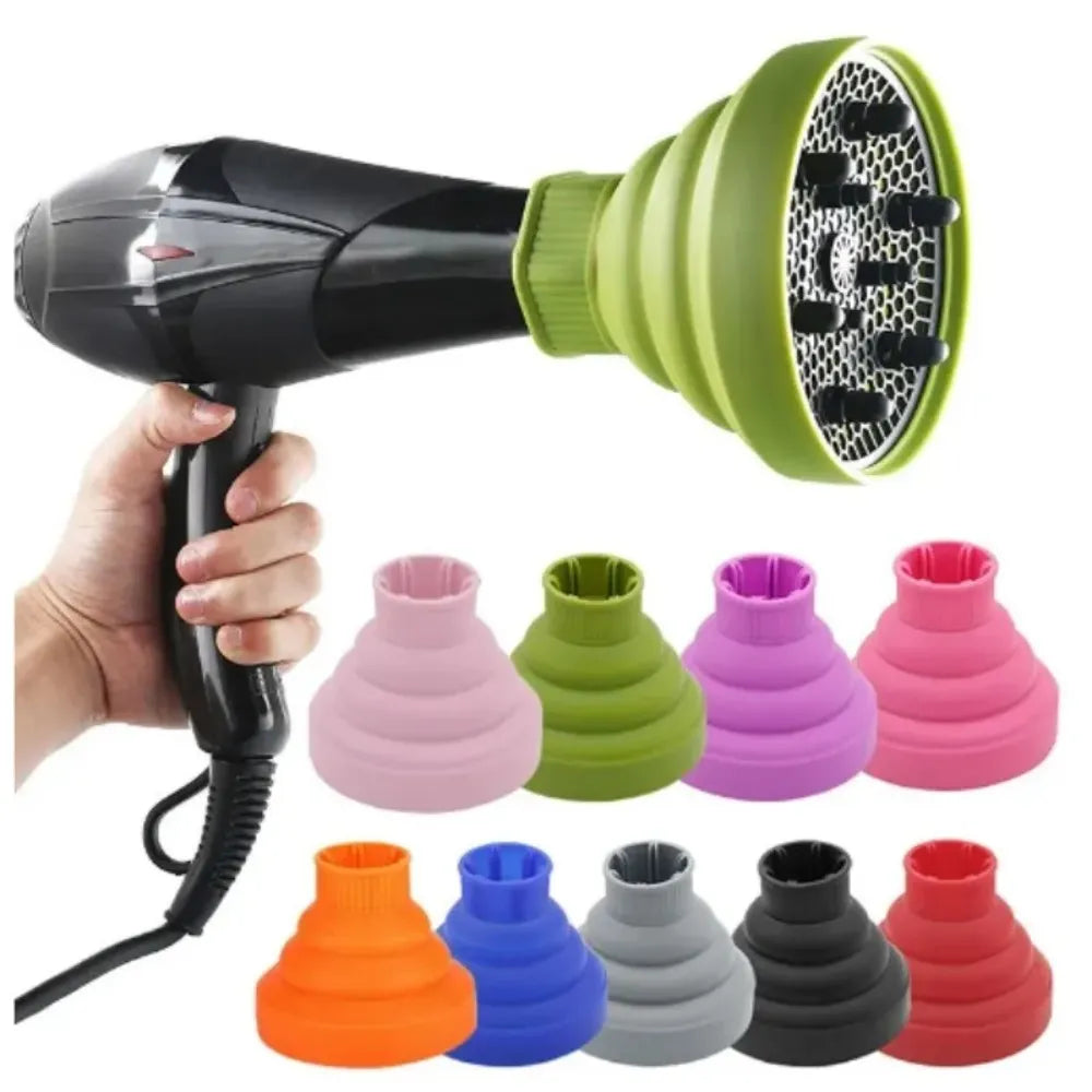 A hand holds a silicone hairdryer diffuser cover with various colored silicone nozzles.