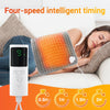 A woman is using a white four-speed intelligent timing heating pad on her back while relaxing.