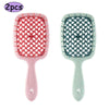 A pair of professional detangling hair brushes, one pink and one mint green, showing the bristles and handles.