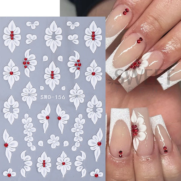 A set of white embossed floral nail stickers featuring red accents on a light gray background.