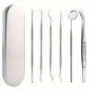 A set of stainless steel dental cleaning tools including probes and a mirror.