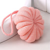 A pink exfoliating bath bubble ball made of soft mesh sponge with a pink loop for gripping.