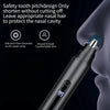 A close-up of a black electric nose hair trimmer being used on a person's nose.