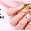 A hand displays several gold chrome powder nails with builder gel extensions and 3D nail art.