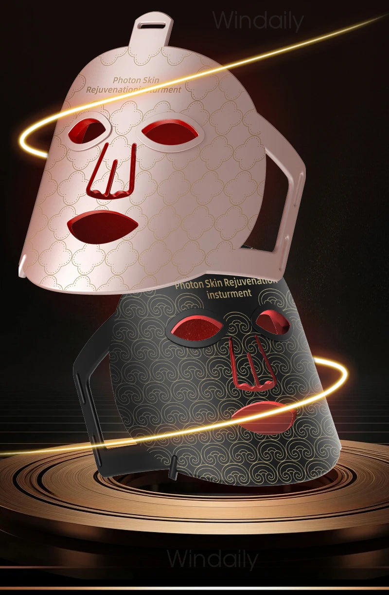A pink and black facial mask device for skin rejuvenation with glowing lines.