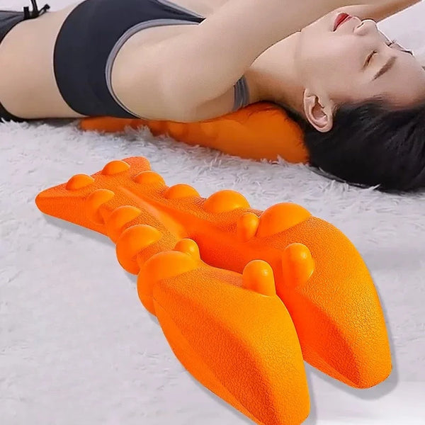 An orange neck and shoulder traction massager is shown being used on a person lying on white fur.