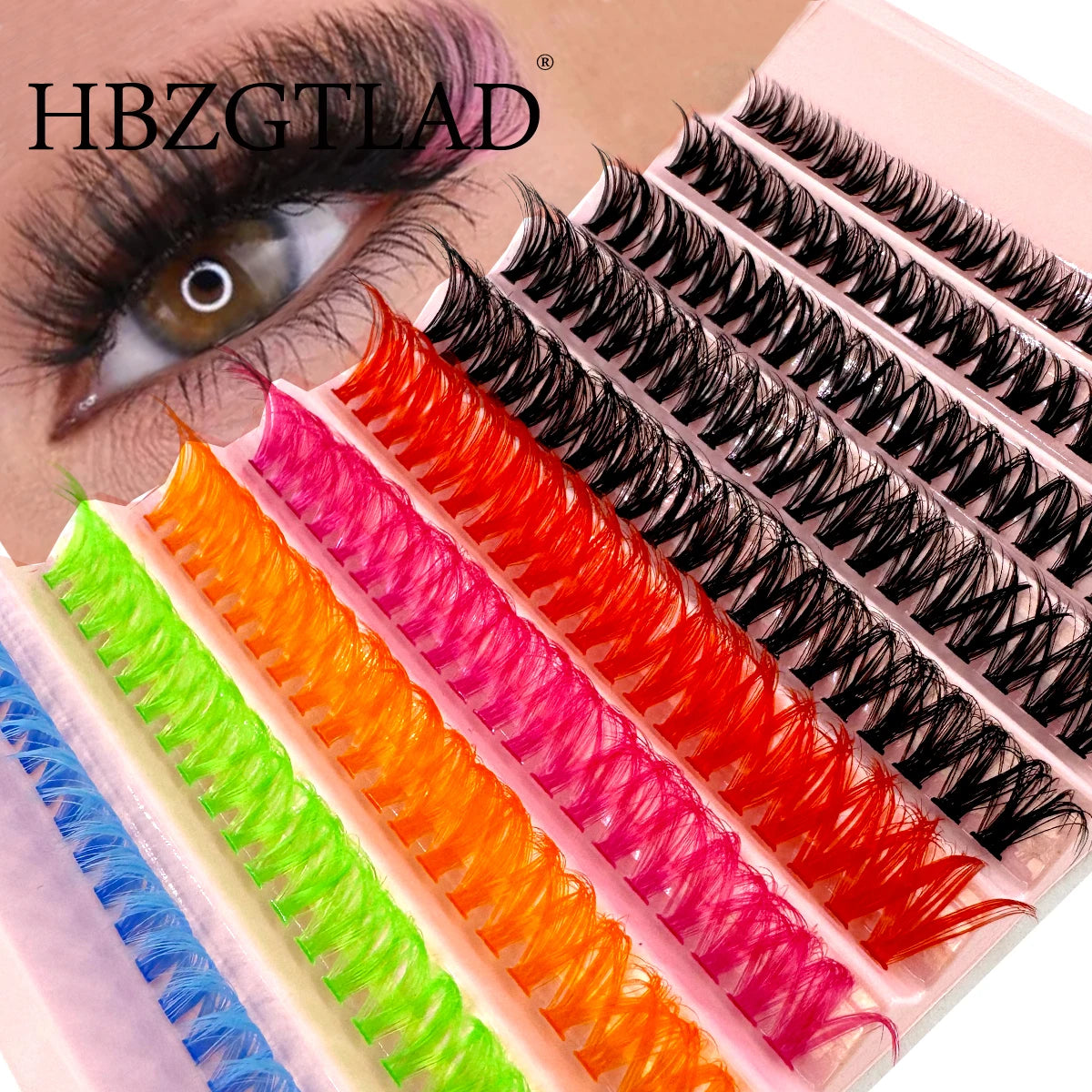 Gros plan d'un ensemble de cils multi-couleurs avec des nuances noires, roses, oranges et vertes.