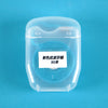 A spool of 50m disposable nylon dental floss contained in a clear plastic container.
