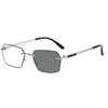 A pair of silver-framed photochromic reading glasses with dark lenses.