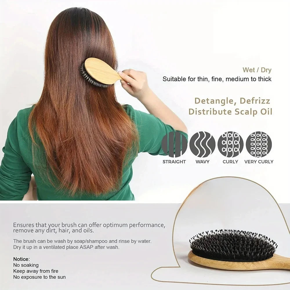 A woman is using a natural boar bristle hair brush with a bamboo handle to style her long brown hair.