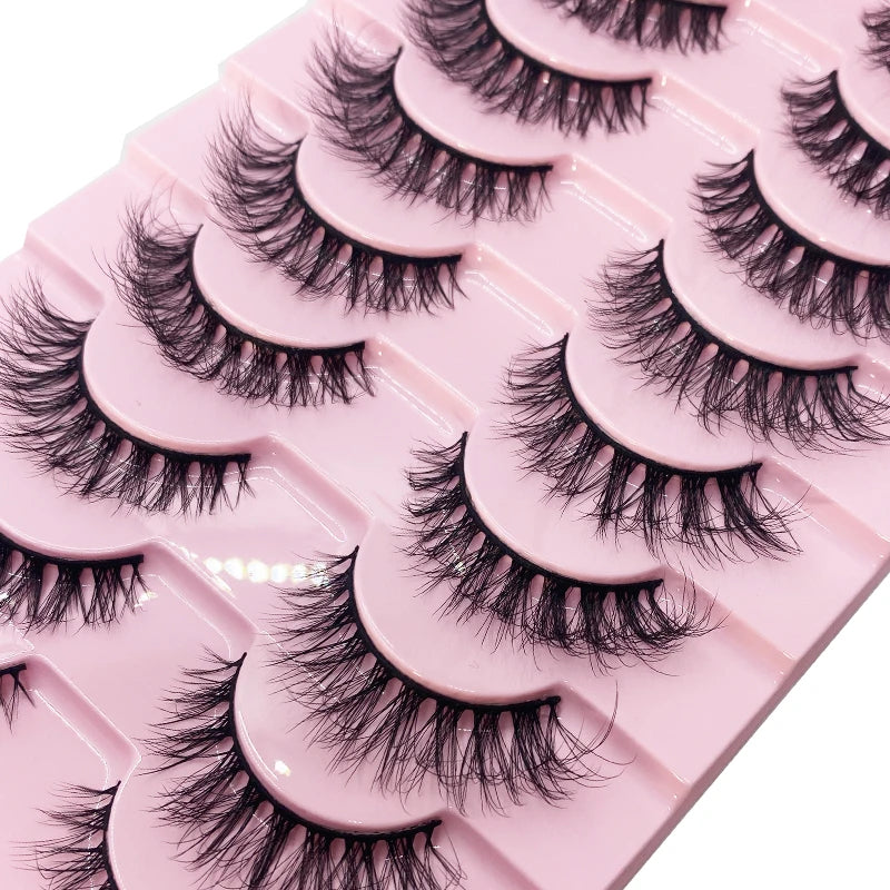 Un plateau rose de kits d'extensions de faux cils mink en 3D, disposés en rangées.
