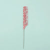 A pink anti-static rat tail comb with a silver handle.