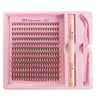 A pink tray containing a DIY lash extension kit with bond, seal, and remover tools.