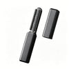 A black portable wireless hair comb and curling iron with a textured comb attachment.