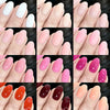A collection of glossy press-on nails in various shades of pink and nude displayed on hands.