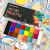 A palette of 20 non-toxic, professional painting colors for body paint and art is displayed on a colorful background.