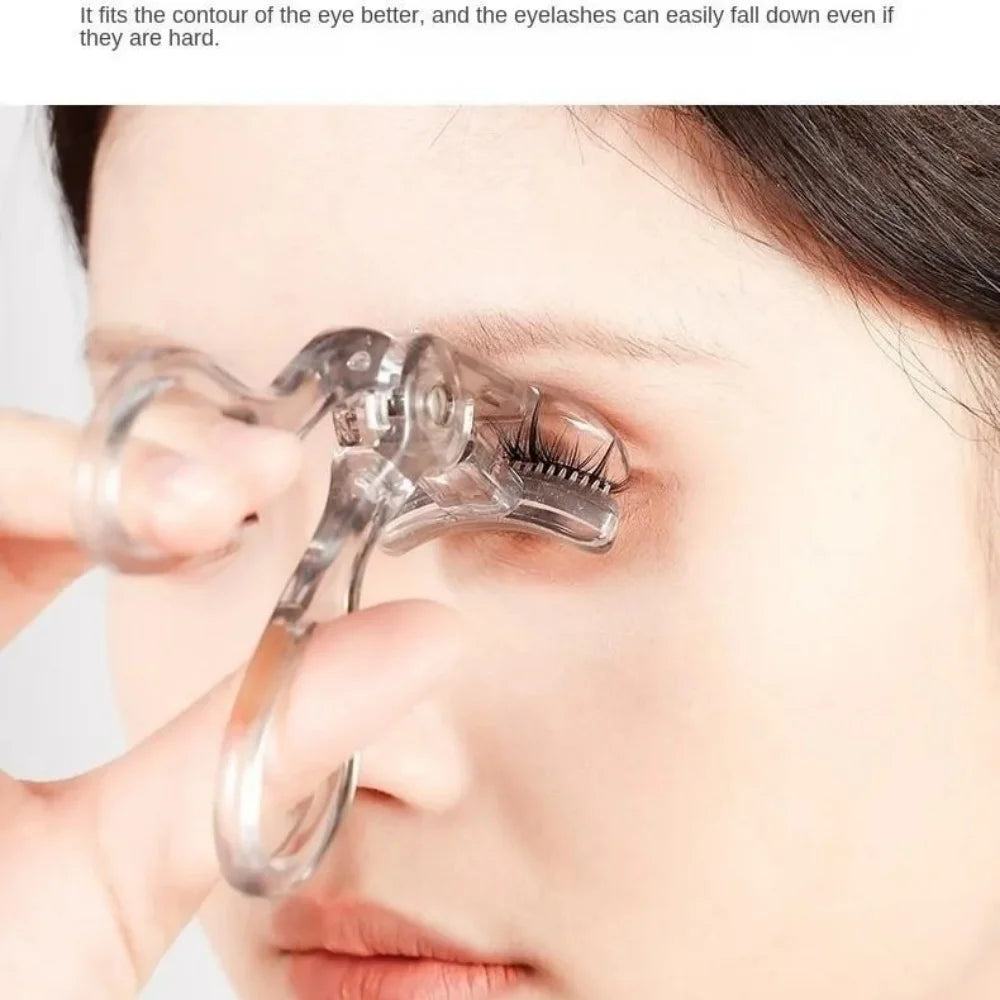 A hand is using a clear dual-type eyelash curler with a comb to curl eyelashes on a woman's eye.