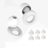 A set of white silicone earplugs shown in various sizes and an open plug.
