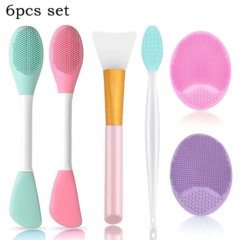 A set of six silicone facial cleansing brushes and mask applicators in various shades of pink, green, and purple.