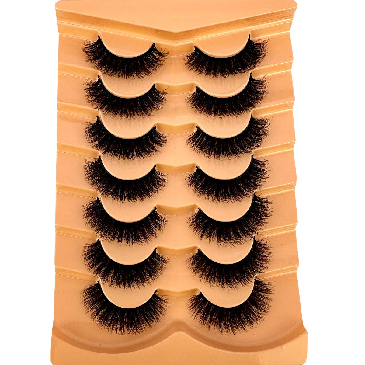 Un tube de faux cils de renard en 3D dramatiques dans une couleur nude ou pêche.