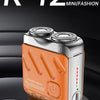 An orange and silver portable shaver labeled R-12 is shown resting on a black grooming device.