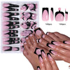 A collection of 144 glossy pink and black press-on nails displayed on hands and a storage tray.