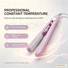 A pink professional ceramic hair curler and straightener tool shown in a studio setting.