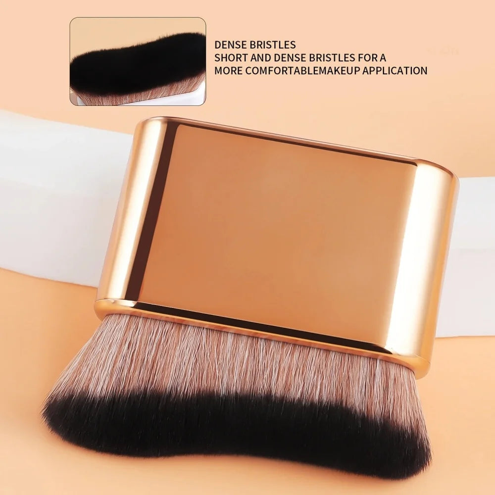 A gold-colored contour foundation brush with dense, short, and dense bristles shown against a light background.