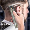 A hand is using a professional electric hair trimmer on a man's side to style his haircut.