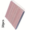 A stack of 50 dual-grit nail files with pink and white handles, viewed from above.
