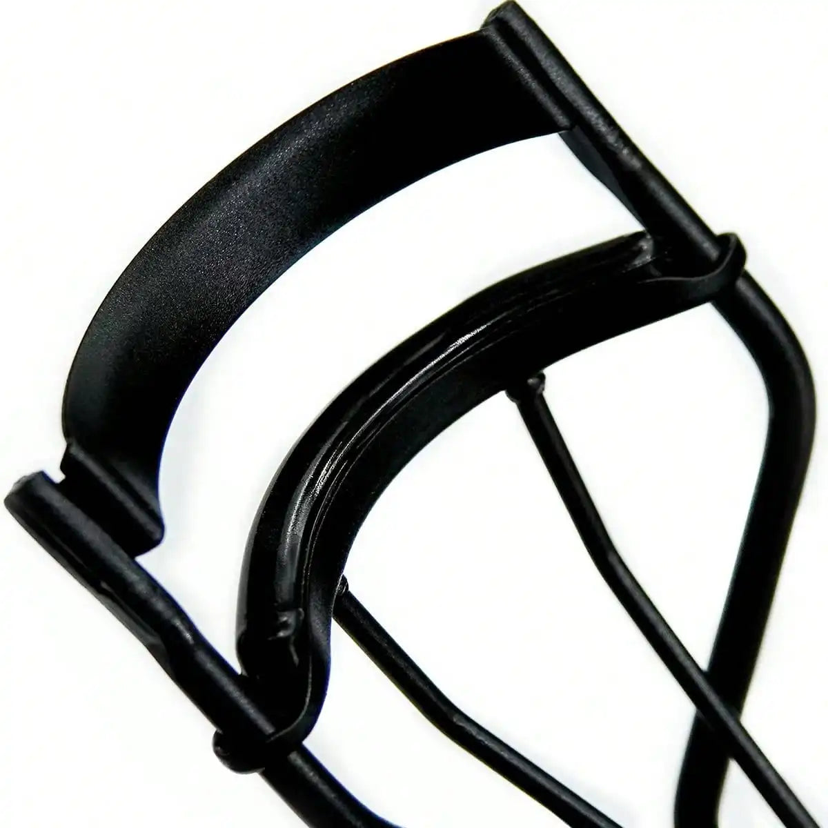 A close-up view of a black metal eyelash curler tool.