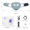 A gray facial mask with black accents and an adapter, controller, and instructions packaged in a box.