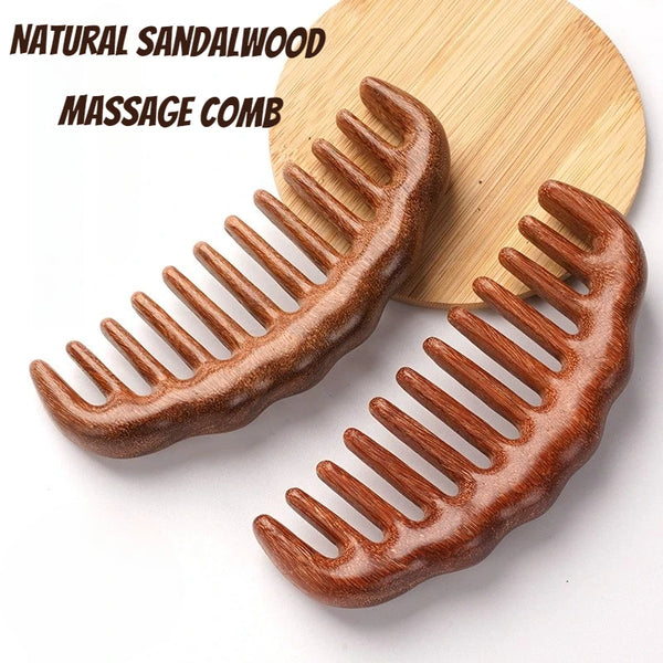 A pair of natural sandalwood wide-tooth massage combs resting on a light wooden surface.