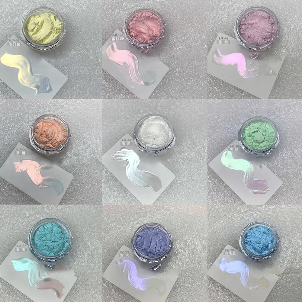 A collection of iridescent glitter powders in various shades, including mint green, pink, and blue, displayed in small glass 