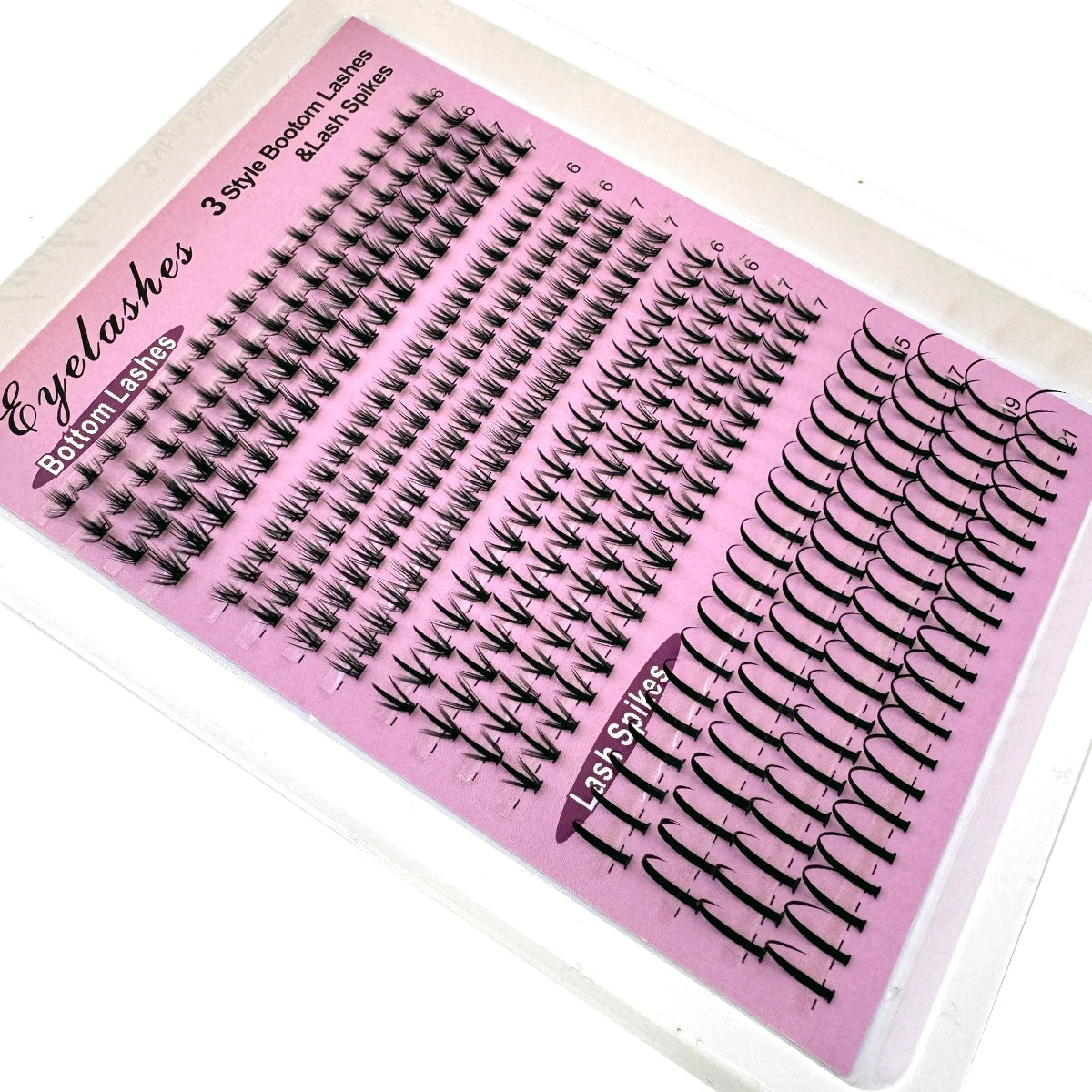 A display of pink eyelash extensions including bottom lashes and lash spikes.