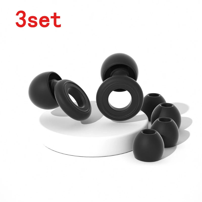 A set of three black silicone ear plugs for sleep and protection displayed on a white surface.