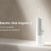 A white Mijia Electric Oral Irrigator 2 device standing on a light surface.