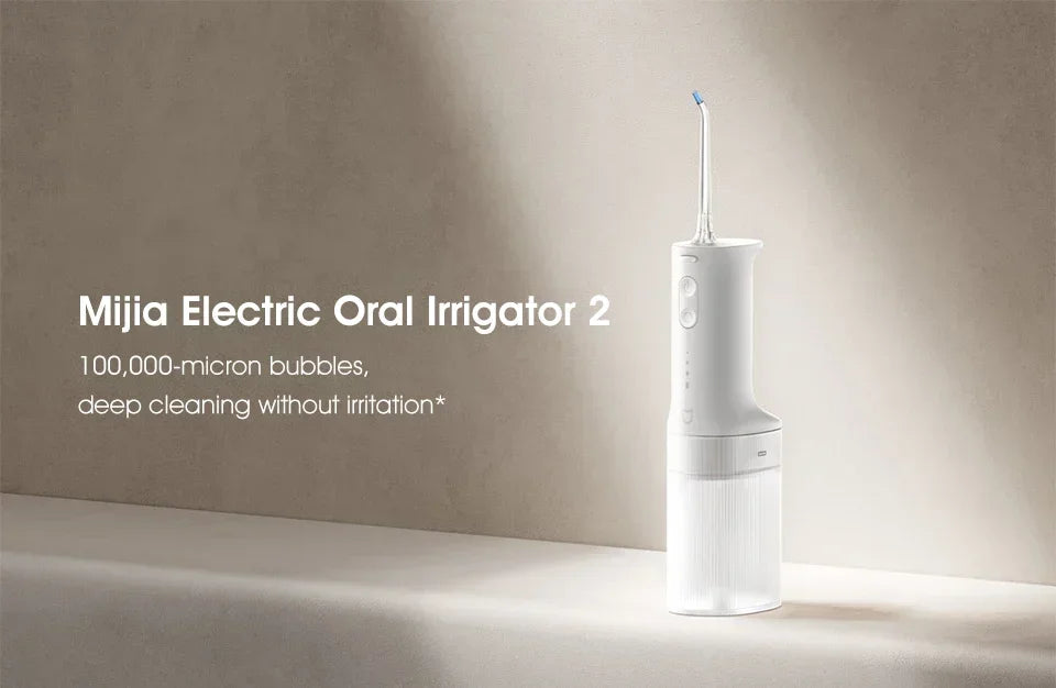 A white Mijia Electric Oral Irrigator 2 device standing on a light surface.