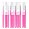 A set of precision pink eyebrow and lash brushes displayed vertically in a row.